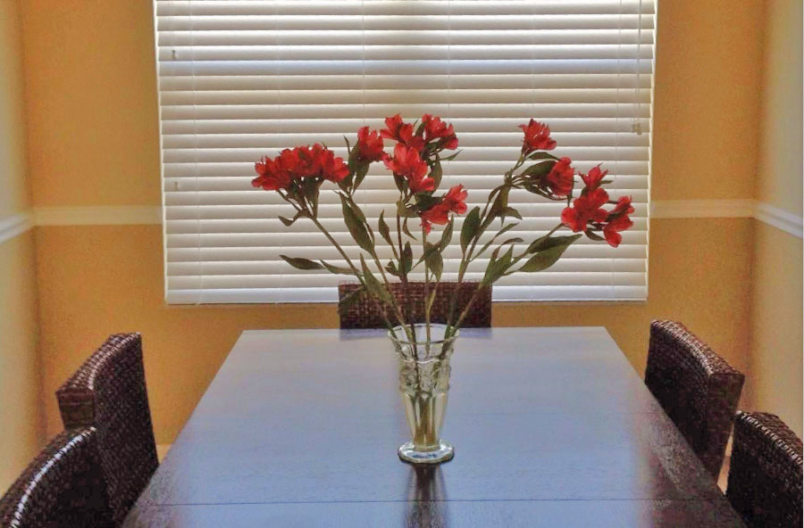 Dining room with horizontal blinds
